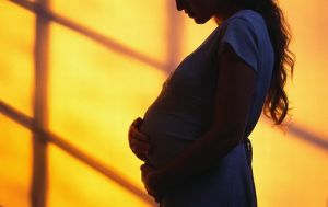 Pregnant Teen in Shadows